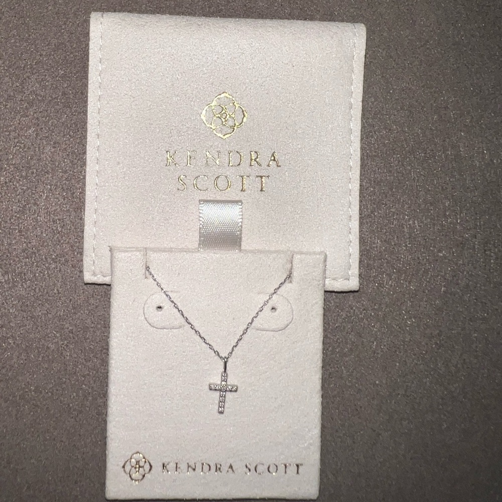 Solid 14k white gold cross necklace with genuine diamonds. Retail value is $500